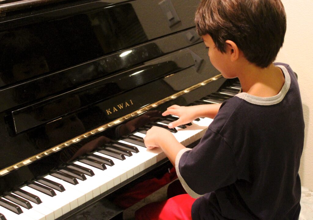 Child playing piano